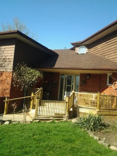 A completed shingle roof by Crystal Clear Roofing